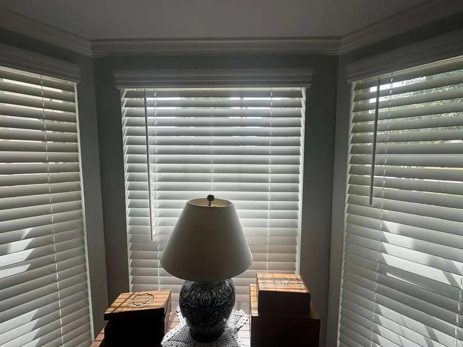 Real wood blinds installed in a Carolina bay window