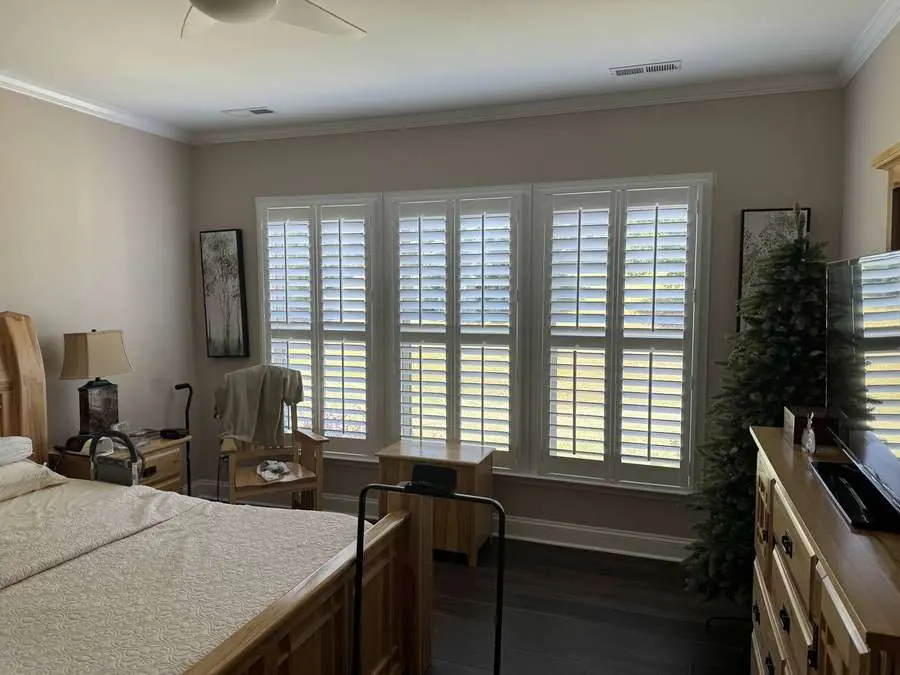 Plantation shutters installed in a Carolina primary bedroom