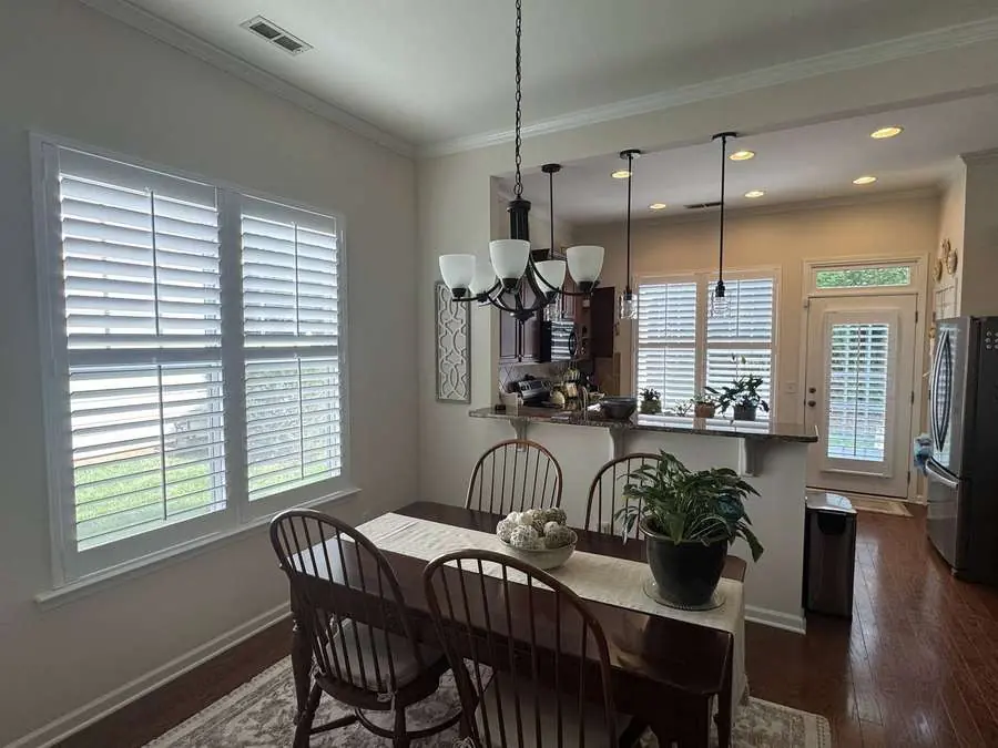 Plantation shutters installed in a Carolina kitchen and dining area