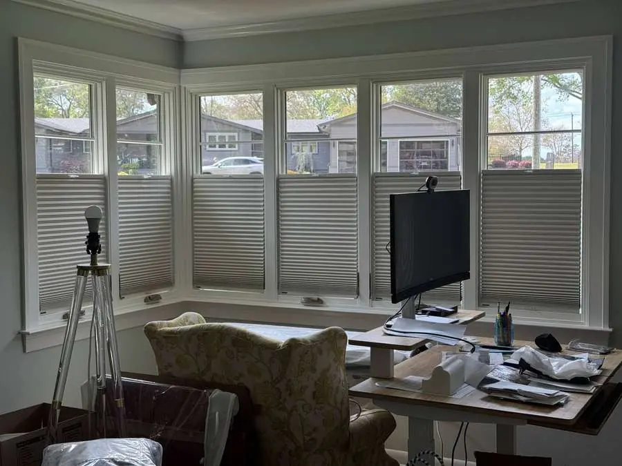 Honeycomb shades installed in a Carolina sunroom office