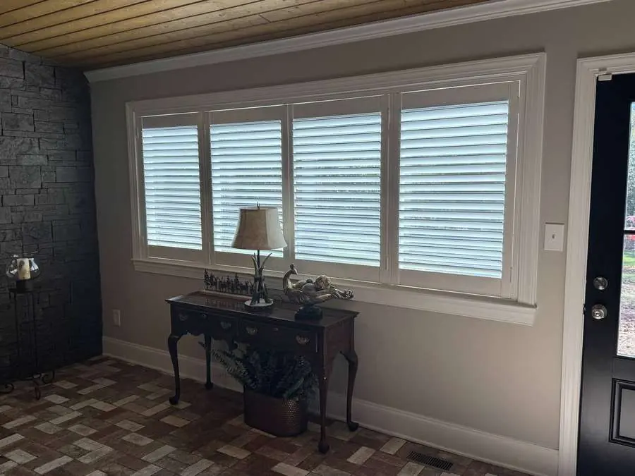 Wood-look shutters installed in a Carolina living room