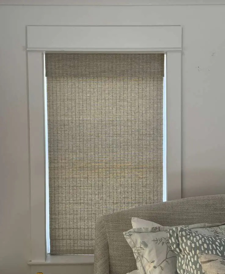 Woven wood shade installed in a Carolina bedroom